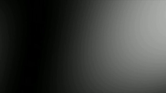 Subtle black to gray gradient background featuring a smooth color transition, perfect for minimalist designs, sophisticated digital displays, and modern abstract graphic projects