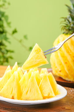 Fresh Zhanjiang Xuwen Pineapple Slices with Fork - Sweet Tropical Fruit on Wooden Table