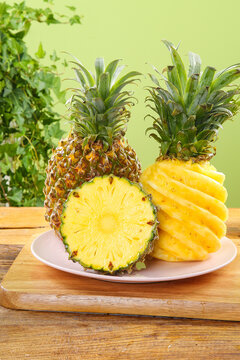Fresh Zhanjiang Xuwen Pineapples Sliced Showing Sweet Golden Pulp and Crunchy Texture on Wooden Board