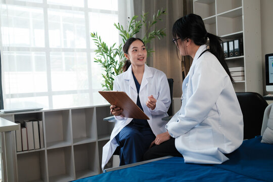 Female doctor discussing patient's health during medical consultation