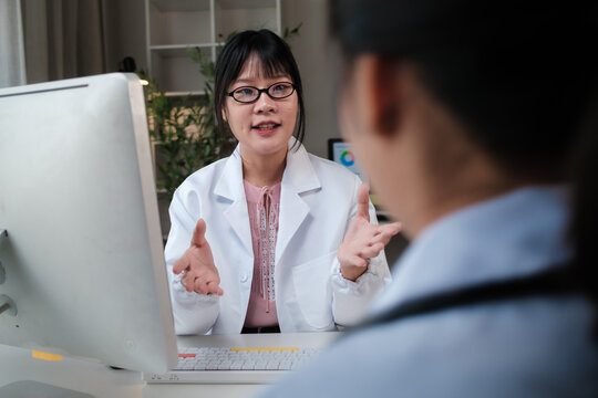 Doctor consulting patient discussing medical healthcare information
