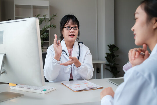 Doctor consulting patient explaining treatment in office