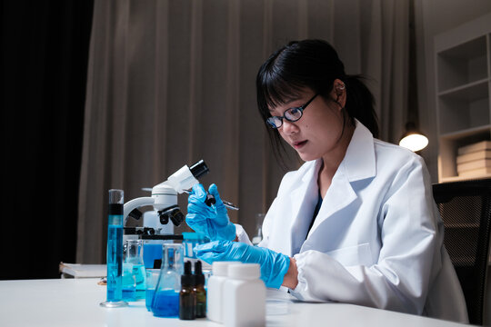 Woman scientist working in laboratory analyzing samples