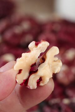 Fresh Xinjiang Walnut Kernel with Red Papery Skin Held in Hand - Premium Chinese Nuts