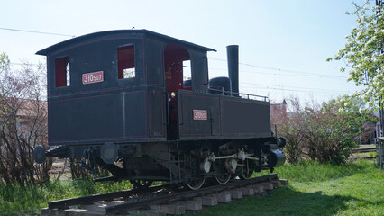 Vintage Black Steam Locomotive 310507 on Display in Spring © Vladimir