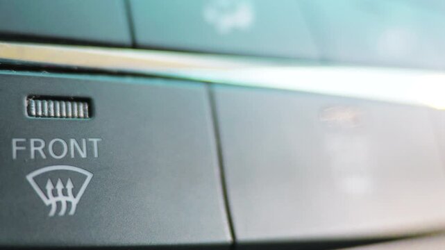 Car front windshield defroster button macro on dashboard console