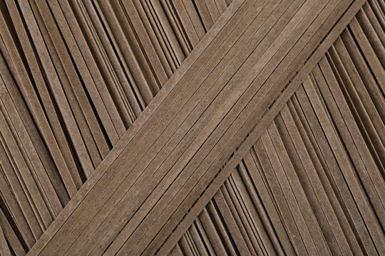Pure black soba noodles with delicious texture arranged in geometric pattern for Japanese seafood cuisine