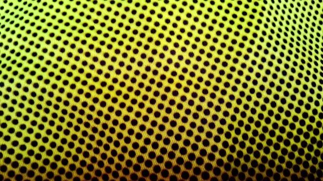 Vibrant yellow dot pattern texture moving in hypnotic digital animation video
