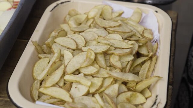 Deep Frying Fresh Potato Slices in Hot Cooking Oil