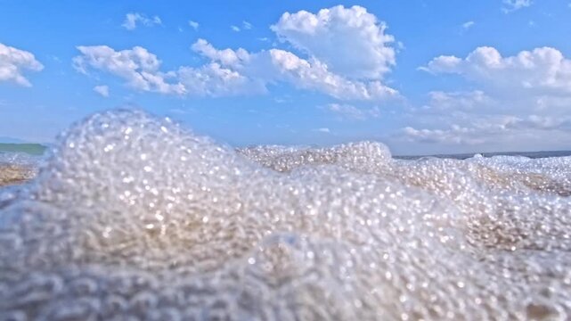 Focus on wet sand near shoreline