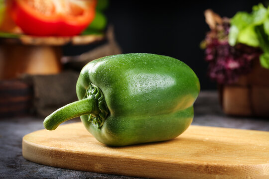 Fresh Green Bell Pepper on Wooden Cutting Board - Healthy Vegetable Food Photography