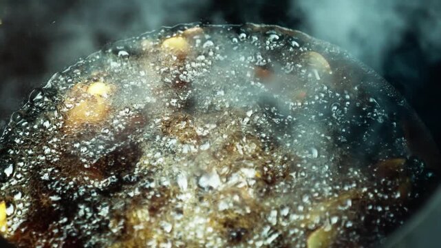 Deep Frying Fresh Potato Slices in Hot Cooking Oil