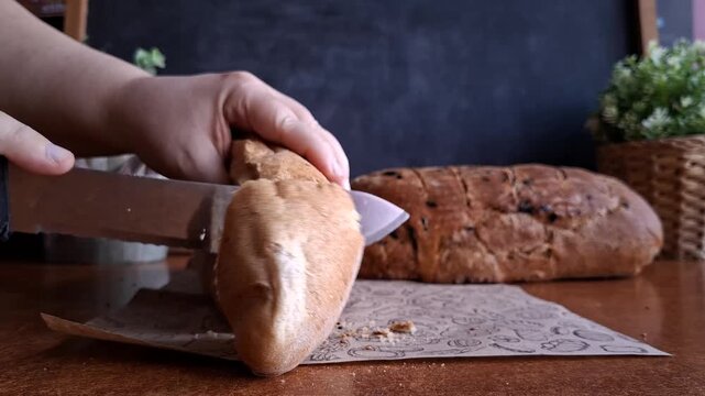 Slicing Fresh Whole Wheat Bread with a Kitchen Knife