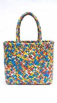 Colorful woven plastic tote bag with bright pattern colorful shopping accessory multicolor recycled material isolated background
