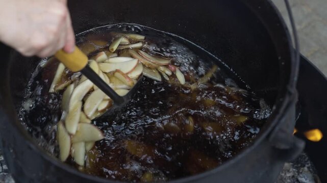 Deep Frying Fresh Potato Slices in Hot Cooking Oil