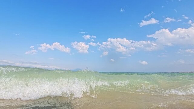 Two keyframes show same tranquil beach scene