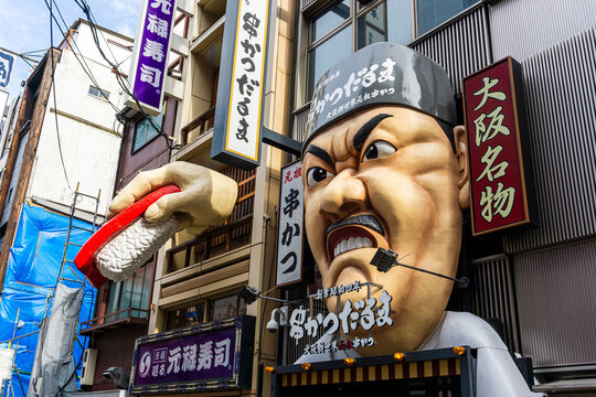 Storefront of Kushikatsu Daruma, a famous restaurant chain in Osaka most recognizable by its angry chef mascot. Started in 1929, it specializes in deep-fried skewers and has 18 Japan branches