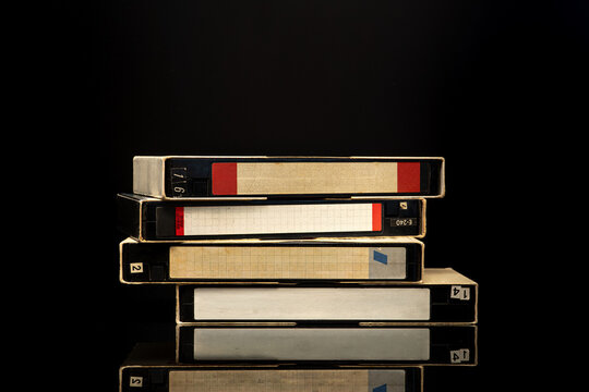 Old video cassettes on dark background