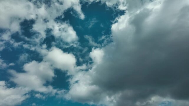 Storm clouds clearing to blue sky
