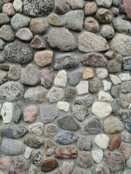 Natural cobblestone wall texture background