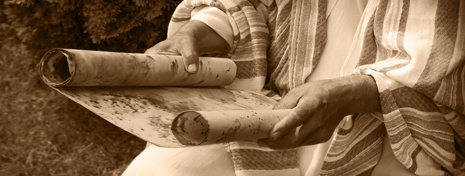 Old man reading the scroll