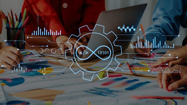 Creative Workspace with Digital Graphs and Data Analysis Elements Overlaying Laptop and Paperwork in Bright Office Environment. Entropy.