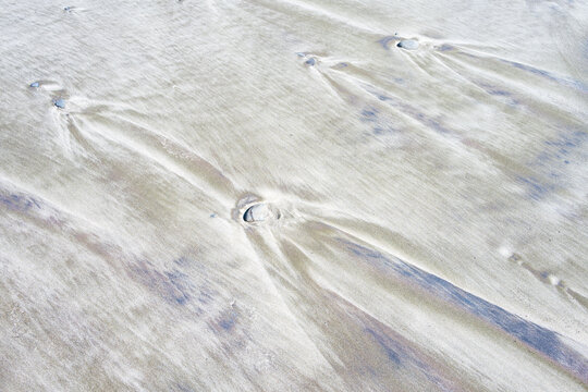 Pebbles in the sand made triangular shaped patterns in sediment and sand as the tide goes out, Muriel O. Ponsler Memorial State Scenic Viewpoint, Oregon coast
