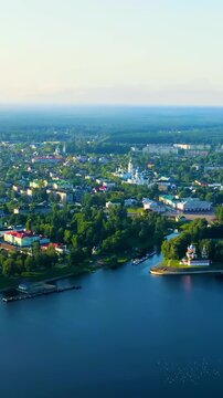 Vertical video. Uglich, Russia. Uglich city from the air, Uglich Kremlin, the main attraction of the city. Early morning. Drone footage. Rich colors