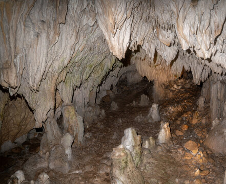 Underground Cave Interior with Stalactites and Stalagmites, Natural Rock Formations, Geology and Adventure Exploration Background