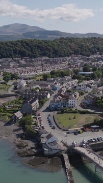 Vertical establishing aerial view of Bangor, city in the north of Wales, United Kingdom