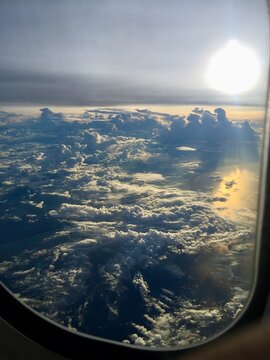 serene cloudscape with sunlight shining through aerial view from airplane window period period period period period period period period period period period period period period period.