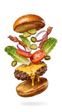 Exploding Burger Ingredients Flying Freely Isolated on White Background