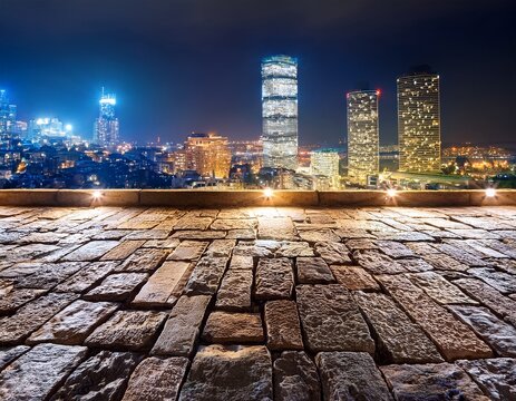 stone wall with city lights at night
