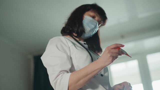 Calm female healthcare professional assessing patient using medical tools at residence. Bright living space showcases professional nurse carefully evaluating patient health with medical instruments