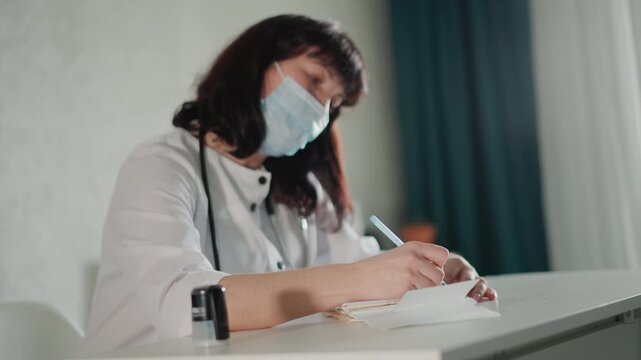 Careful doctor writing. Calm medical practitioner documenting patient information diligently. Serene clinician recording treatment details with precise handwriting and calm atmosphere