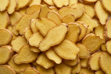 Fototapeta premium Macro view of fresh ginger slices overlapping each other