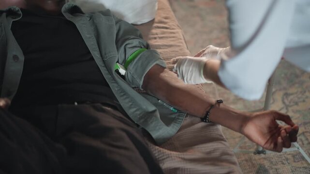 Urgent IV insertion. Emergency medical team places IV promptly. Patient in distress receives urgent intravenous access. Tense scene where paramedics skillfully insert IV in emergency situation