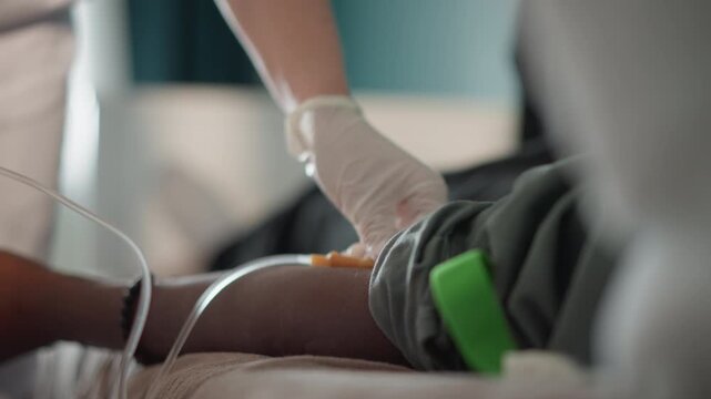 Home intravenous therapy procedure. Patient undergoes sterile IV insertion at home. Male patient undergoes sterile intravenous catheterization at his residence with proper procedures