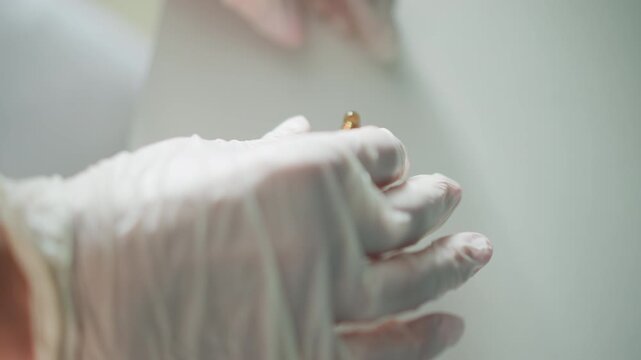 Careful injection handling. Safe and careful injection preparation procedure. Healthcare professionals performing precise and cautious ampoule opening for injections in clinical environments