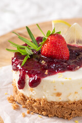 Mini cheesecake with red berry jam and fresh fruit © anammarques