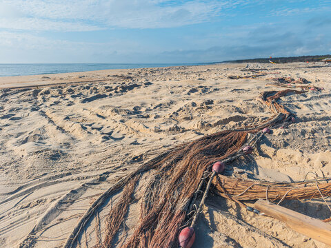 Traditional Arte Xavega fishing nets on sandy beach