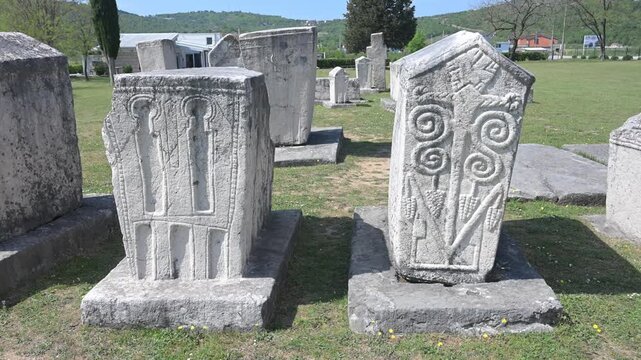 Medieval stecci tombstones at the Radimlja necropolis in Stolac, Bosnia and Herzegovina. Historic medieval stone monuments.
