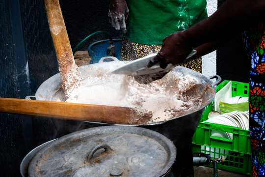 Ogun State, Nigeria &ndash; July 4, 2026. Two women prepare amala, a traditional Nigerian yam flour dish, at a food stall