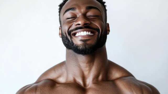 A happy individual displaying strong muscles.