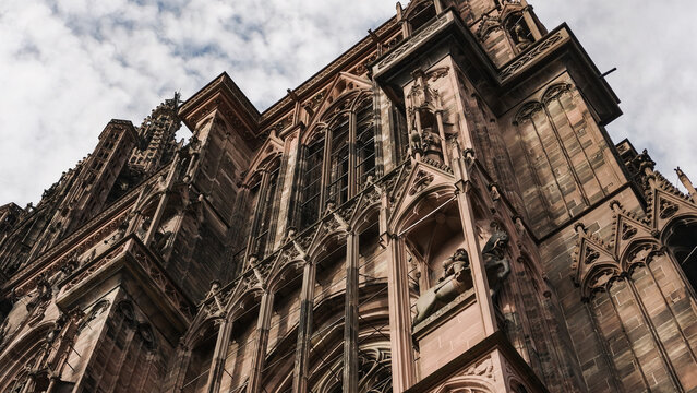 Ornate details of Strasbourg Cathedral's historic gothic facade reaching skyward