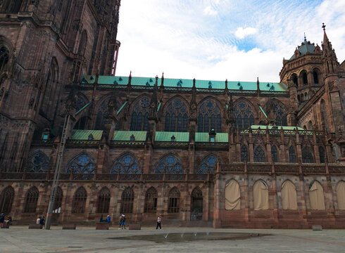 Strasbourg Cathedral with its elaborate Gothic architecture and historical details under a cloudy sky