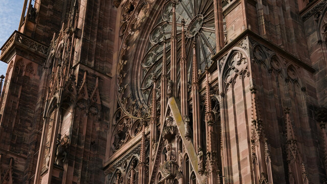 Ornate Gothic architecture with intricate details of a historic cathedral's facade and rose window