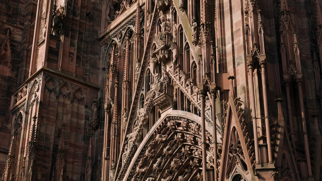 Strasbourg Cathedral showing detailed Gothic architecture and sandstone facade sculptures