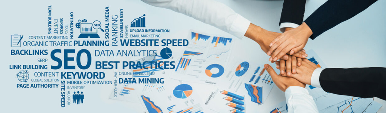 A diverse group of professionals collaborates on a business strategy, focusing on SEO and data analysis. Their hands meet in agreement over performance charts and analytics. Amity
