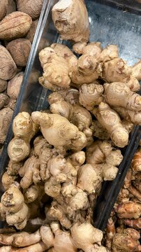 Fresh ginger root. A video featuring smooth camera work, showcasing ginger and various other kitchen spices.